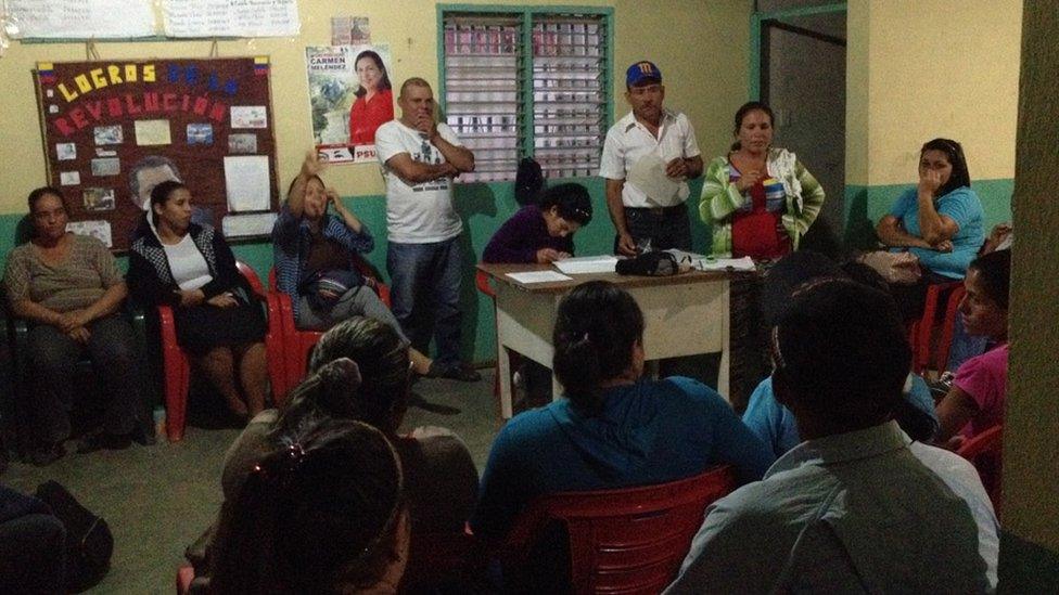 Residents of Monte Carmelo gather to discuss issues affecting their village