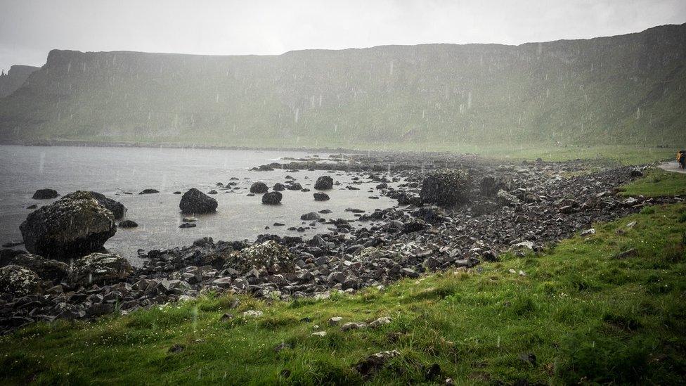 The Giant's Causeway is a landmark in Antrim , Northern Island of 40,000 interlocking basalt columns, the result of an ancient volcanic eruption.