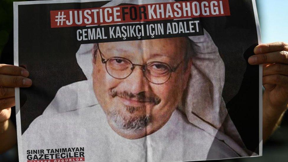 Friends of Jamal Khashoggi hold posters bearing his picture as they attend an event marking the second anniversary of his killing in Istanbul (2 October 2020)