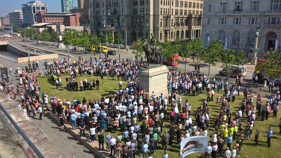 People in Liverpool observing the minute's silence