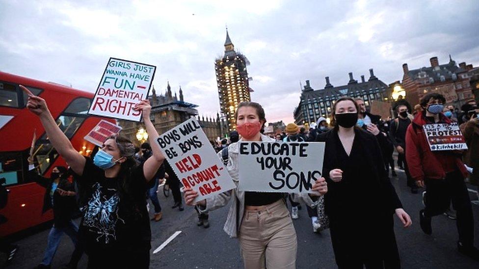 Protestors holding placards march on to Westminster Bridge as they demonstrate against the government's Police, Crime, Sentencing and Courts Bill