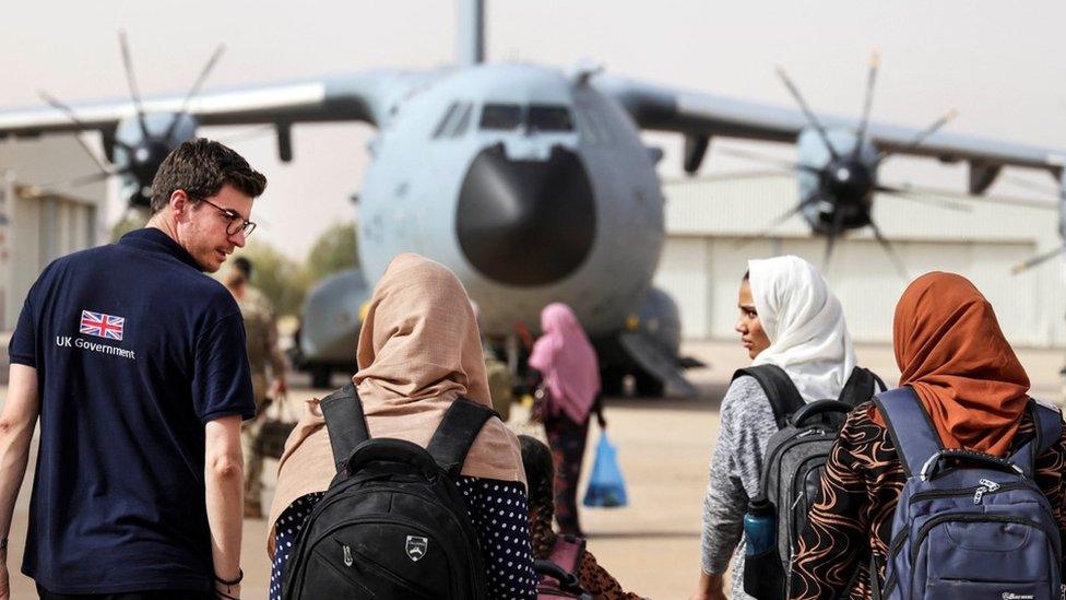 British nationals board an RAF aircraft, during the evacuation to Cyprus,