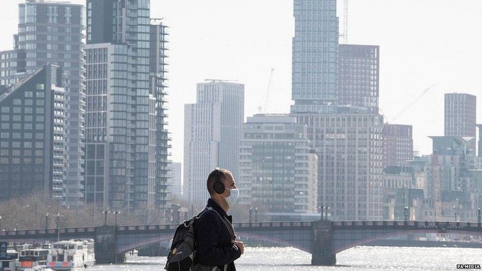 A man wearing a face mask in central London