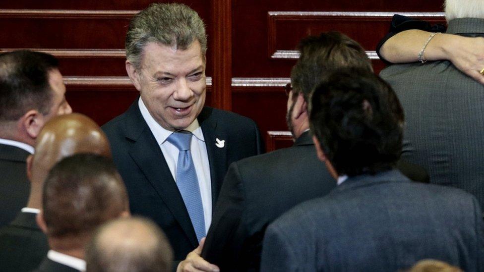 Colombian President Juan Manuel Santos (C) greets after delivers a speech to install the ordinary session of the Congress in Bogota, Colombia, 20 July 2017