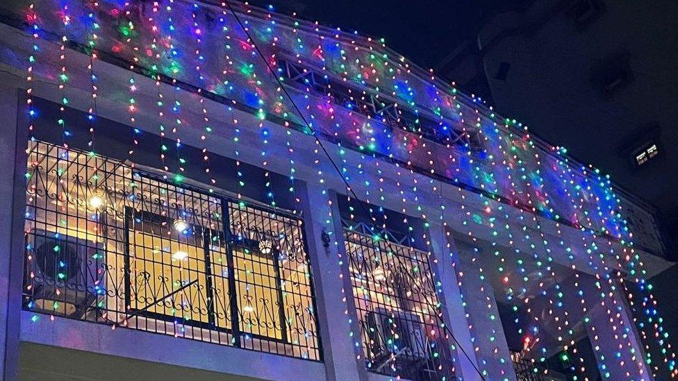 A house draped in lights