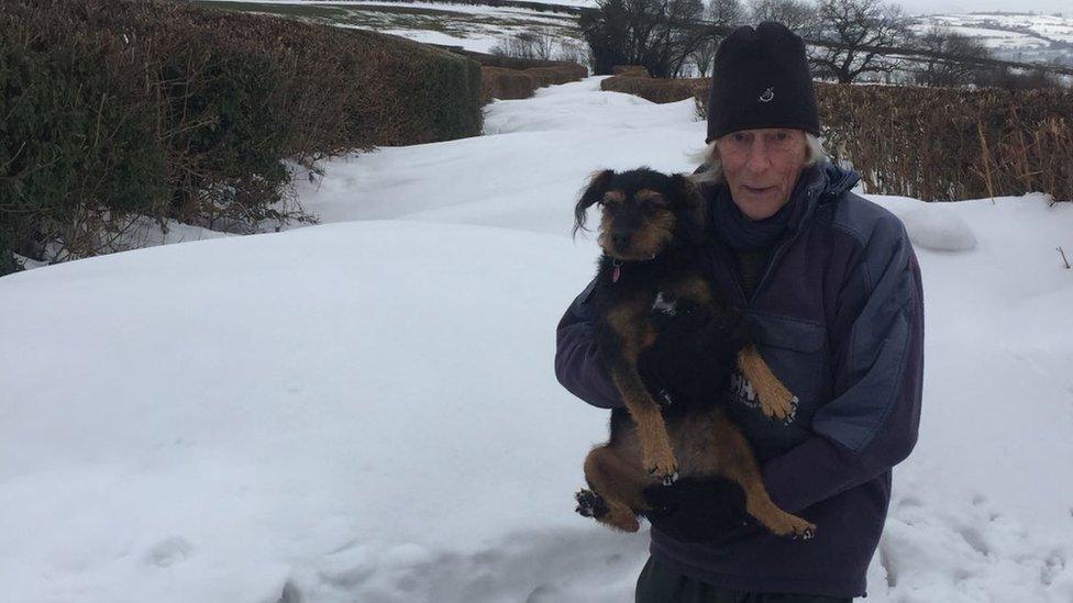 Ian Cole and his dog in the snow