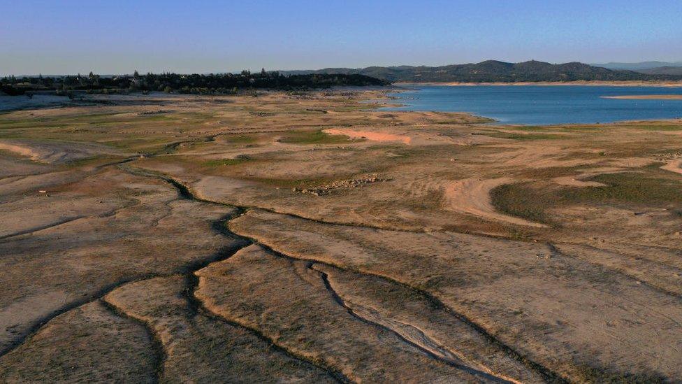 In an aerial view, low water levels are visible at Folsom Lake on May 10, 2021 in Granite Bay, California.