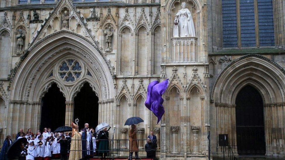 King Charles unveiling a statue of the late Queen at York Minster