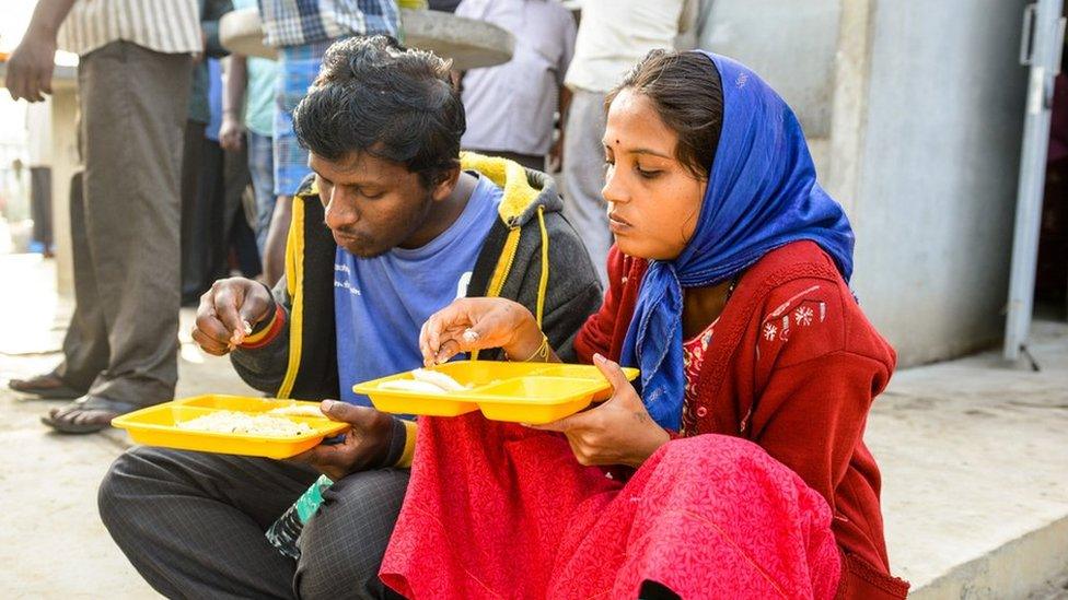 A couple have breakfast at the Indira canteen