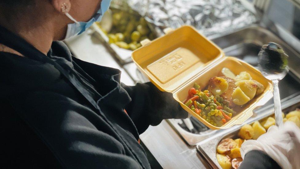 Volunteer serving food