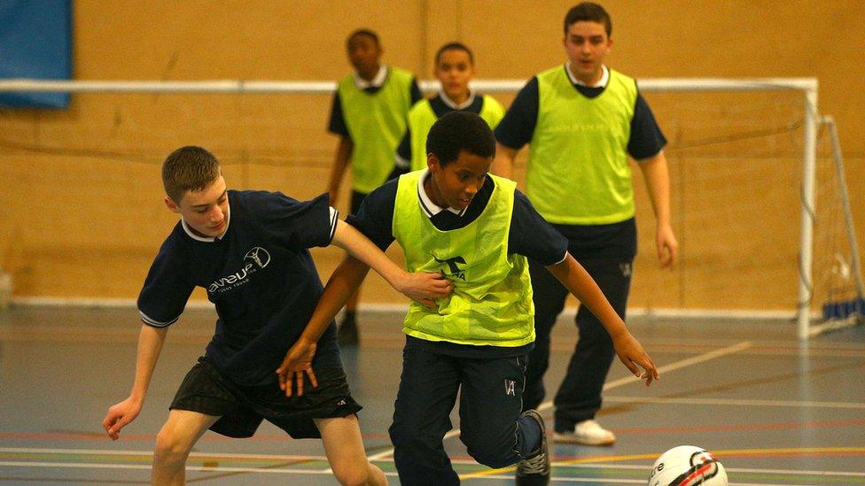 Boys playing football