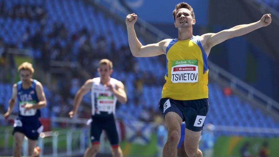 Ihor Tsvietov of Ukraine (left) wins the gold medal in the men's 400m - T54 - race