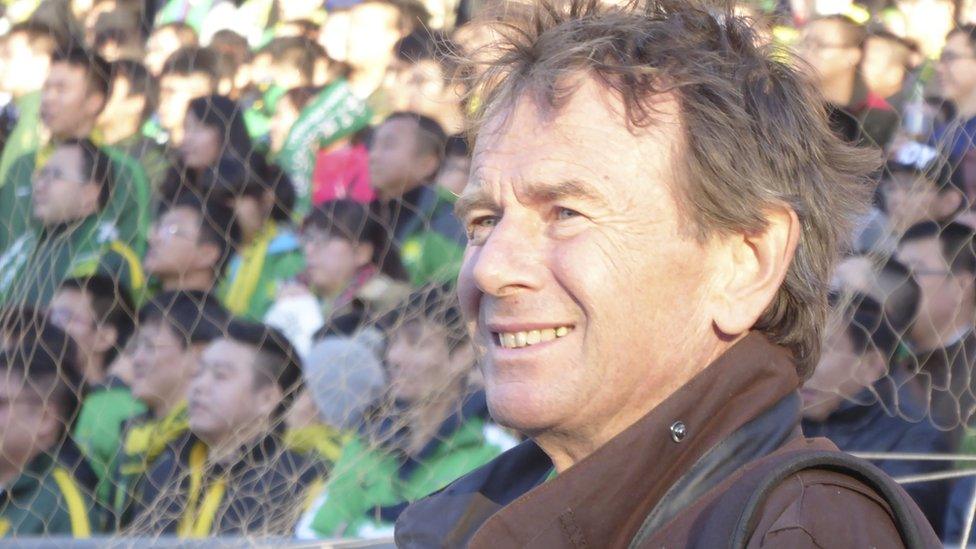 Michael Wood in the crowd at a football match in China