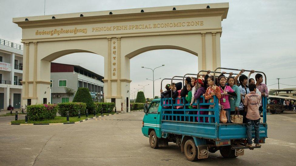 Cambodian textile workers being trucked to work