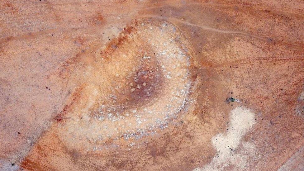 A dried-up dam can be seen on farmer Ash Whitney's drought-effected property located west of the town of Gunnedah in north-western New South Wales in Australia, 8 June 2018.