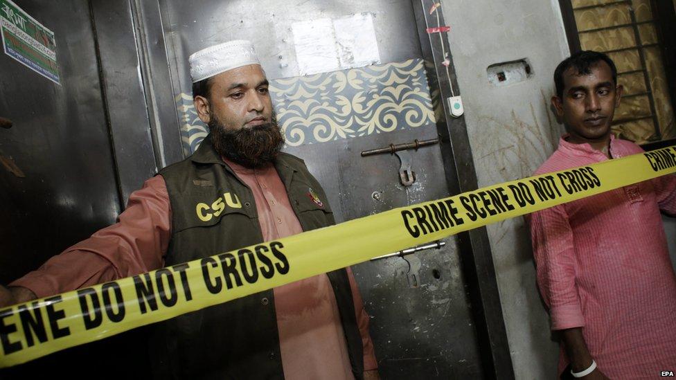 File photo: Members of the Crime Scene Unit stands guard in front of the gate of blogger Niloy Chakrabarty Neel's flat, after he was hacked to death by unknown assailants in Dhaka, Bangladesh 07 August 2015