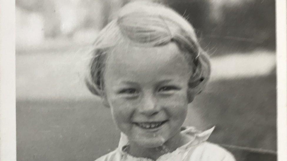 A black and white photo of a girl