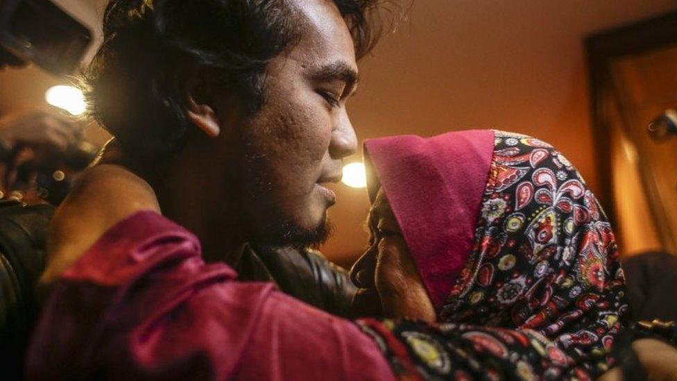 Mohd Radzuan Othman (L), one of the nine returning Malaysian nationals hugs his mother upon arriving at the Bunga Raya complex, Kuala Lumpur International airport in Sepang, Malaysia, 31 March 2017.