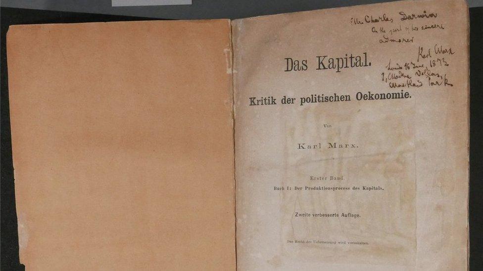 An old copy of Karl Marx's "Das Kapital". First page, with inscription written on it