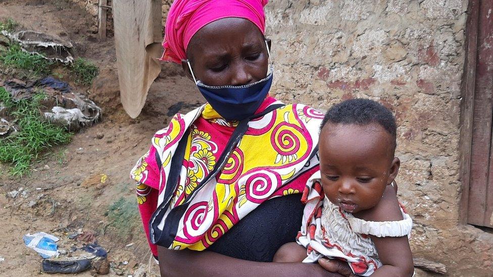 Peninah Bahati Kitsao and one of her children in Mombasa, Kenya