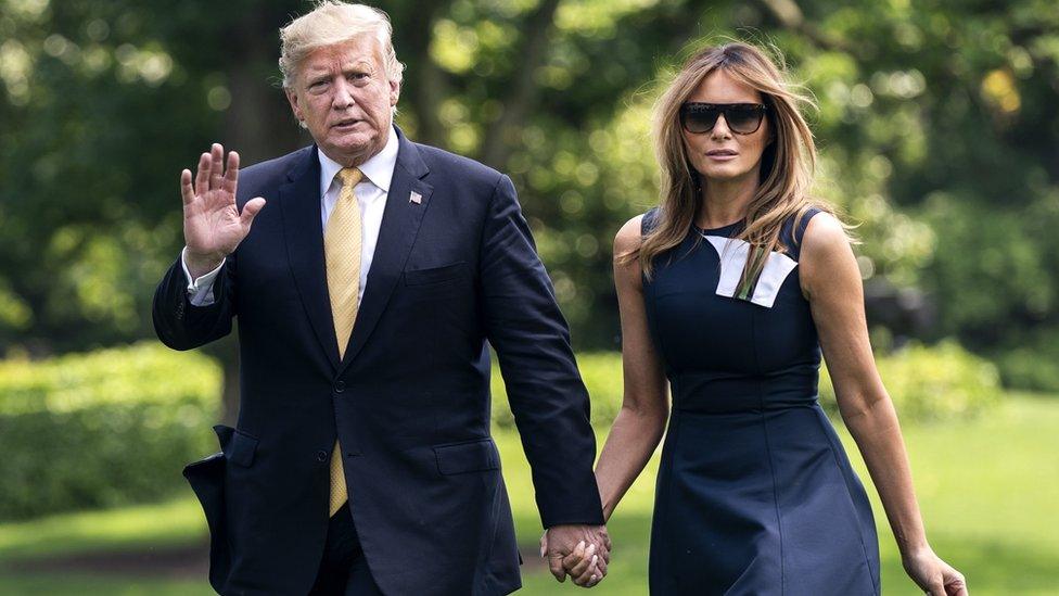 Donald Trump and Melania Trump holding hands