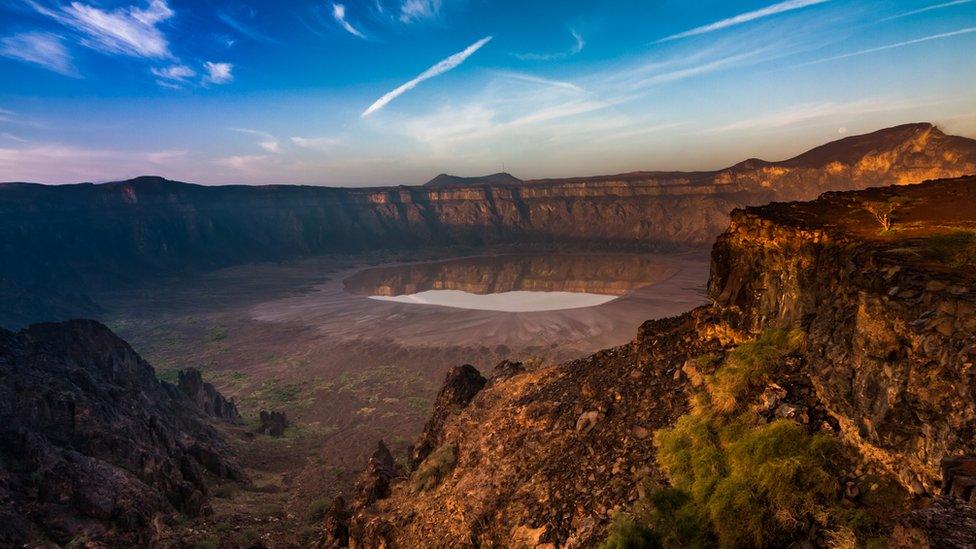 Landscape view of Al Wahbah Crater - a large crater with a salt field within