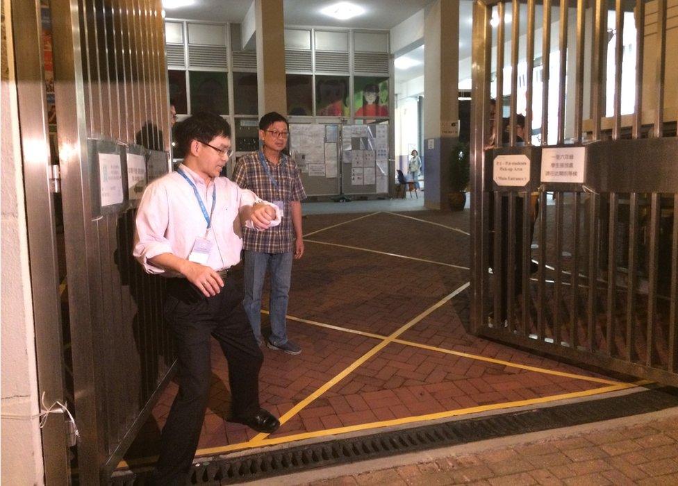 Picture of election officials closing the gates in Hong Kong on 22 November 2015