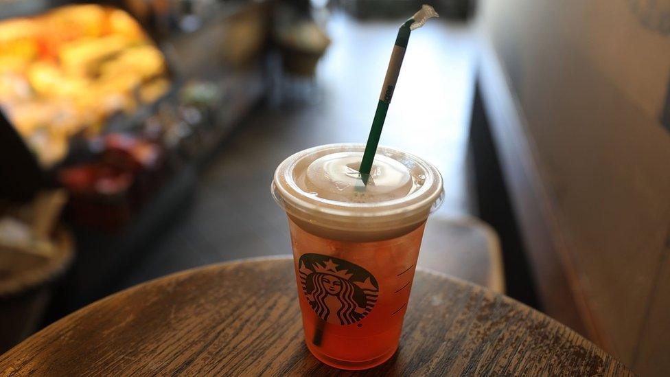 A plastic straw is seen in a Starbucks drink on July 9, 2018 in Miami, Florida.