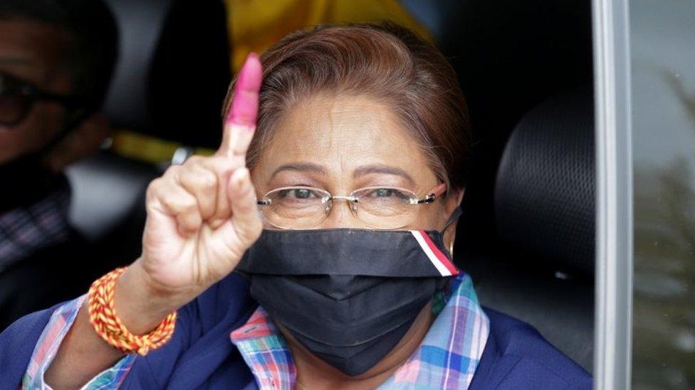 Trinidad and Tobago"s former prime minister Kamla Persad-Bissessar from the opposition United National Congress (UNC) gestures after casting her vote in a general election in Port of Spain, Trinidad and Tobago, August 10, 2020.