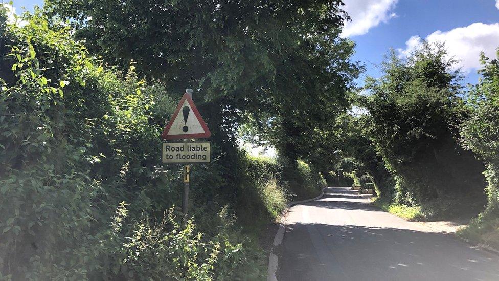 Road liable to flooding sign