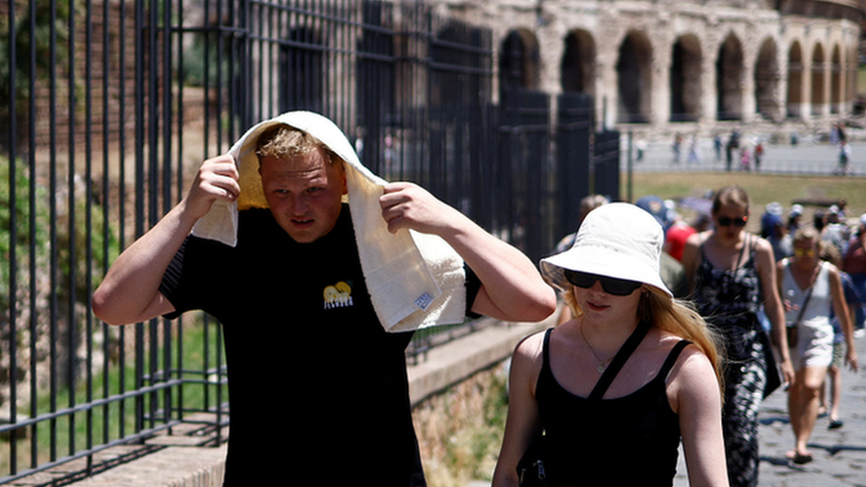 A man sheltering from the sun during a heatwave in Rome, Italy on Tuesday