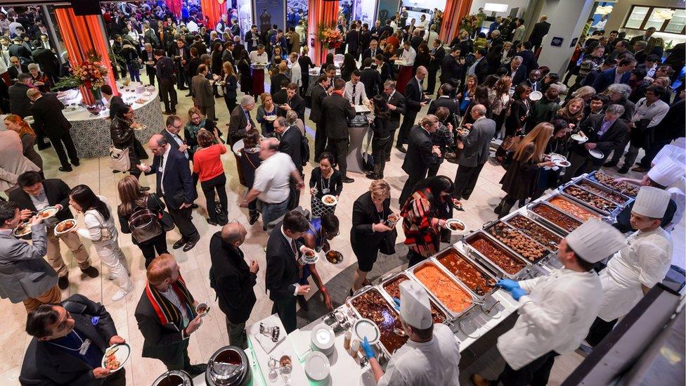 People share a lunch during the World Economic Forum