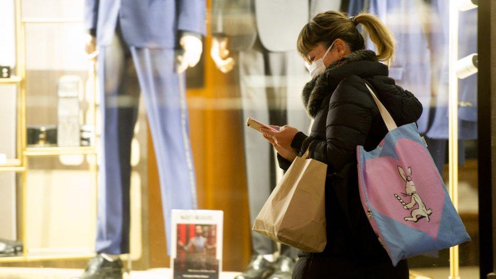 Young woman holding a mobile phone