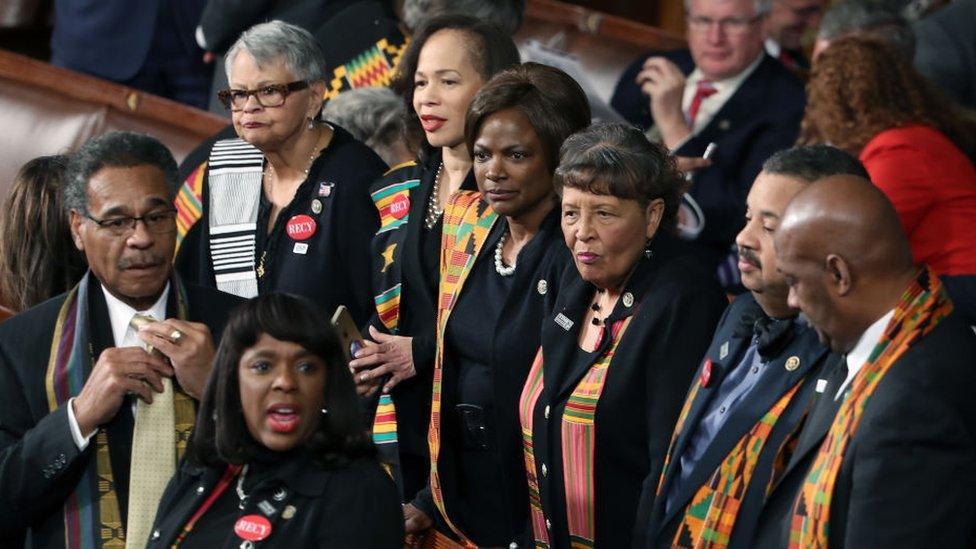 Members of Congress wear black clothing and Kente cloth in protest before the State of the Union address in the chamber of the U.S. House of Representatives January 30, 2018