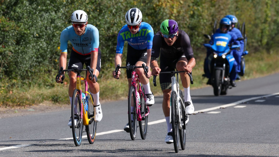 A group of three cyclists