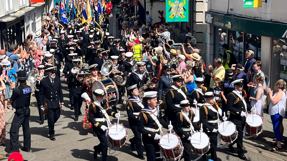 A band leads the parade through the town