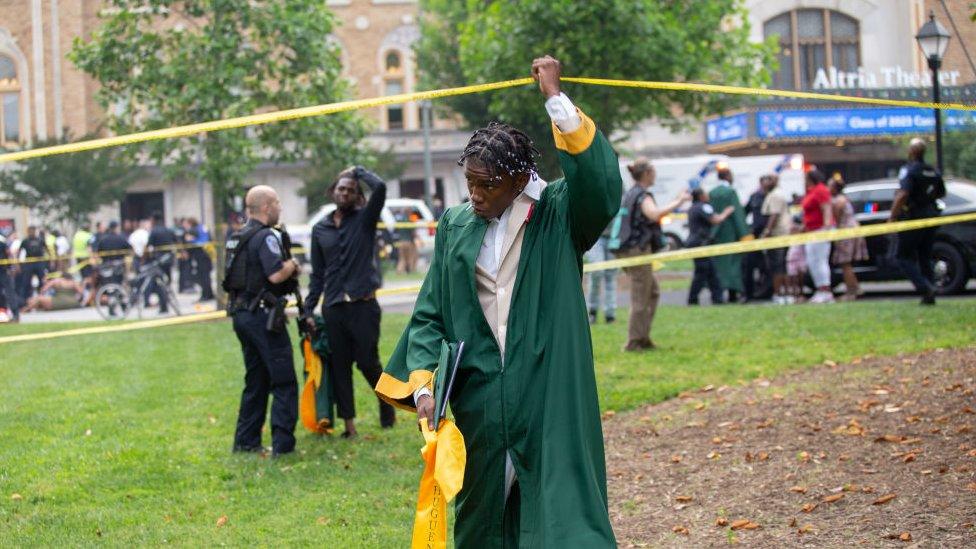 Image shows scene of shooting outside the Altria Theatre after the Huguenot High School graduation ceremony