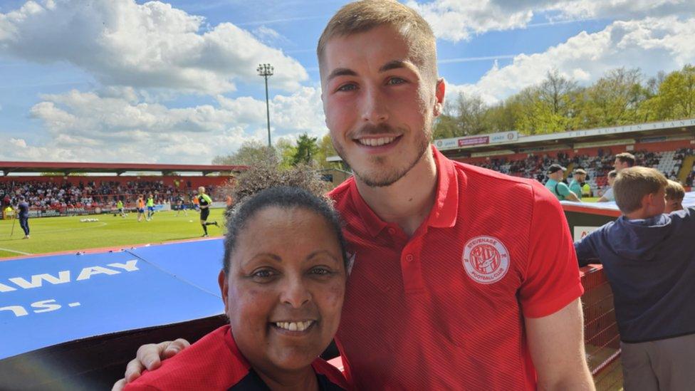 Fiona Brook and Stevenage FC midfielder Dean Campbell