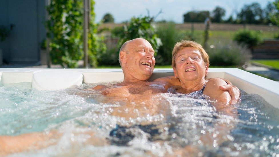 Retiree couple in a hot tub