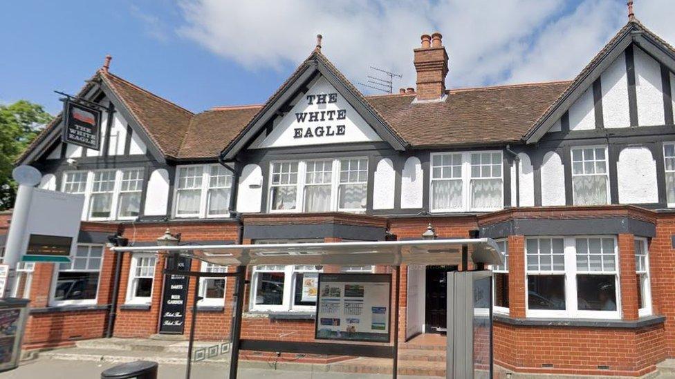 a pub with beams on the outside