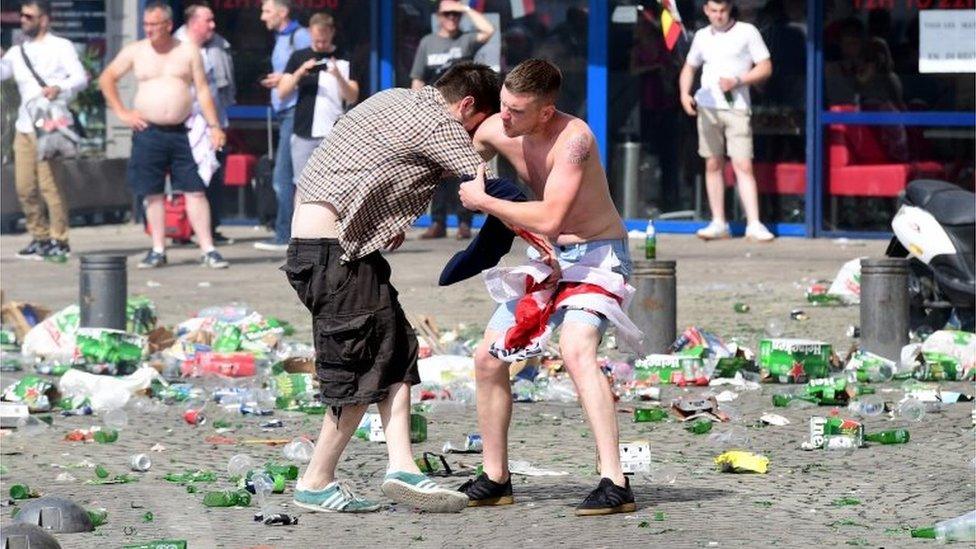 England fans help each other after tear gas use in Marseille