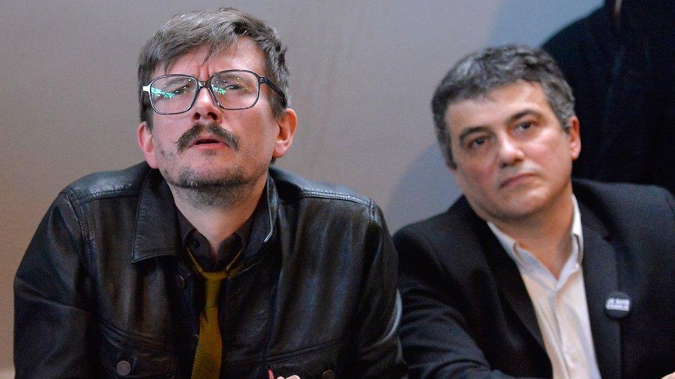 Charlie Hebdo cartoonist, Renald Luzier (C) aka Luz and Patrick Pelloux (R), Charlie Hebdo journalist, during the Charlie Hebdo press conference held at the Liberation offices in Paris on January 13, 2015 in Paris, France