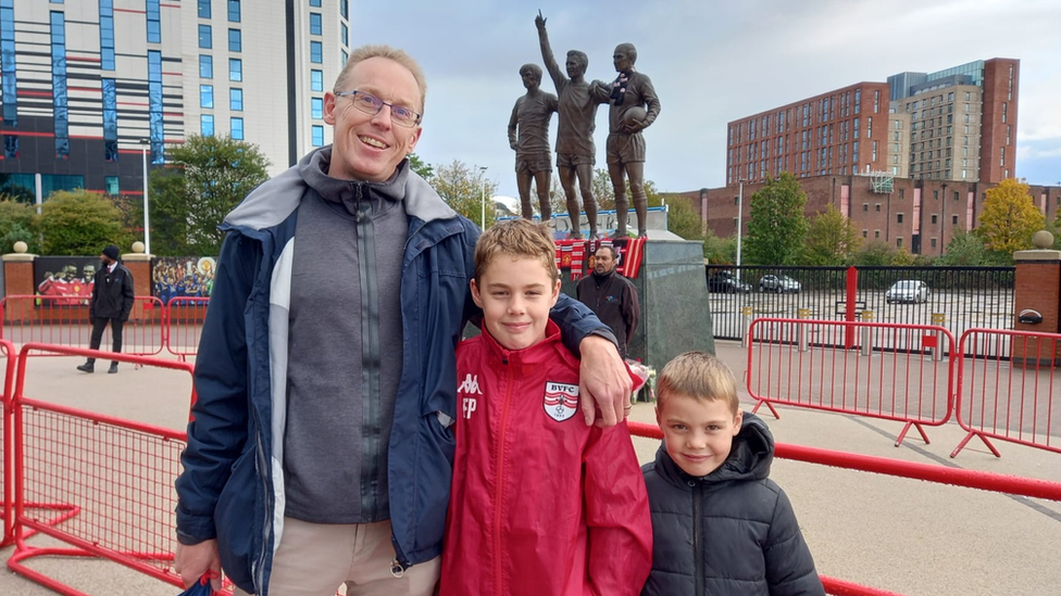 Glenn, Freddie and Albert Palmer from Surrey outside Old Trafford