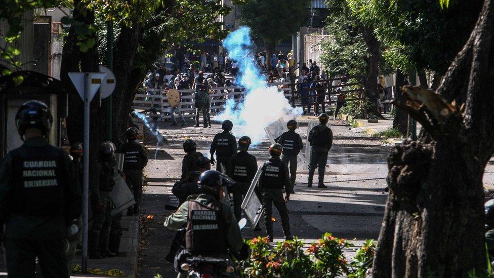 Members of the Bolivarian National Guard face opposition protestors during a demonstration against the National Constituent Assembly called by President Nicolas Maduro, in Caracas, Venezuela, 04 July 2017.