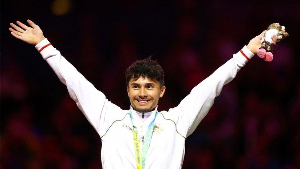 Jake Jarman celebrates his all round gymnastics gold.