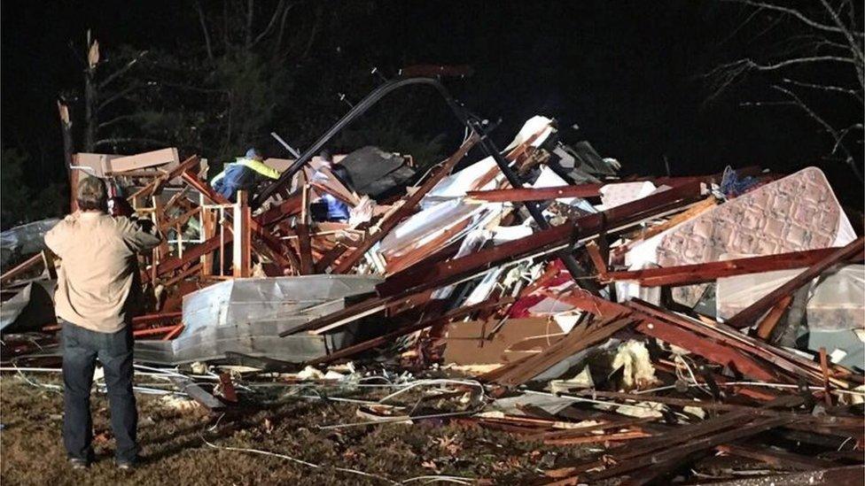 A handout photo released 29 November by the Colbert County Emergency Management Agency shows tornado damage to a home near Tuscumbia, Alabama.