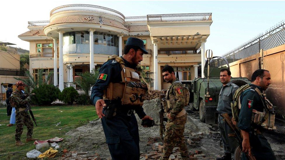 Afghan policemen inspect a midwife training centre after an attack in Jalalabad city, Afghanistan July 28, 2018