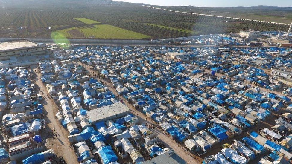 An aerial view shows the Bab al-Salama camp, set up outside the Syrian city of Azaz on Syria's northern border with Turkey