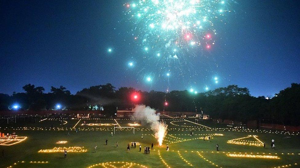 A general view of the Madan Mohan Malviya Stadium decorated with candles by athletes is pictured during track pujan ceremony ahead of the Hindu festival of Diwali in Allahabad on November 2, 2021.