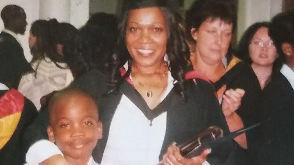 Osime as a child with mother Joan Martin at her graduation